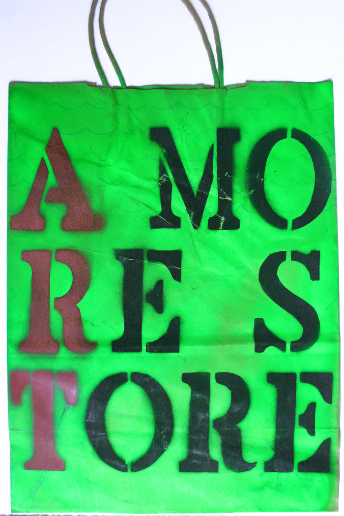 A More Store green bag with stenciled lettering